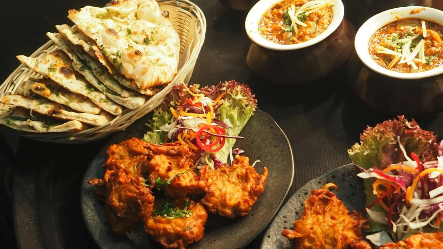 Chacha Wow signature dishes - Butter Chicken, Goat Curry, and Thali Platters in Winnipeg